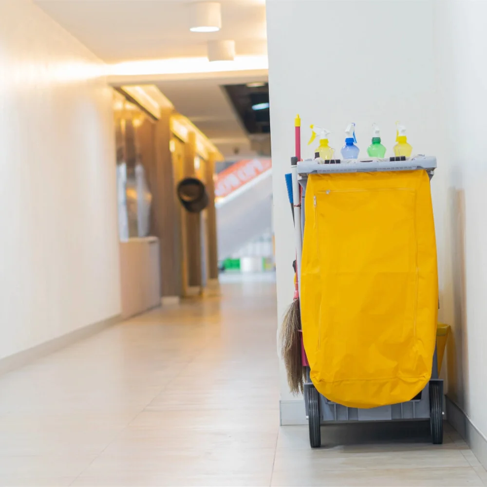 a commercial janitor at work in tampa bay cleaning an office passage